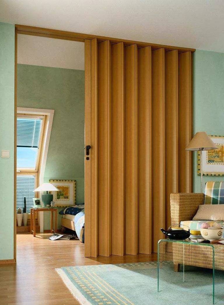 PVC folding door installed in a Dubai home — Pure White 2.5mm accordion door used as room divider between living spaces