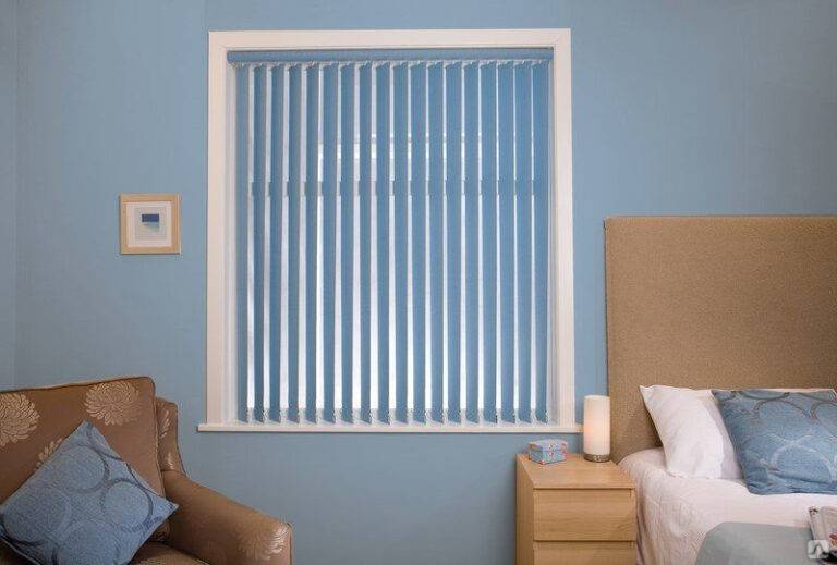 Vertical blinds on sliding glass doors in a Dubai villa — white fabric vertical louvres