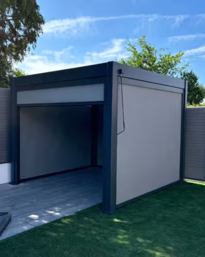 Zip screen blinds installed on a modern Dubai patio — grey fabric providing shade