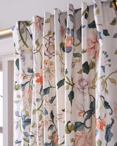 Soft floral curtains with a blackout lining in a Dubai master bedroom