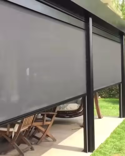 Zip screen blinds integrated into a modern pergola system in a Dubai garden