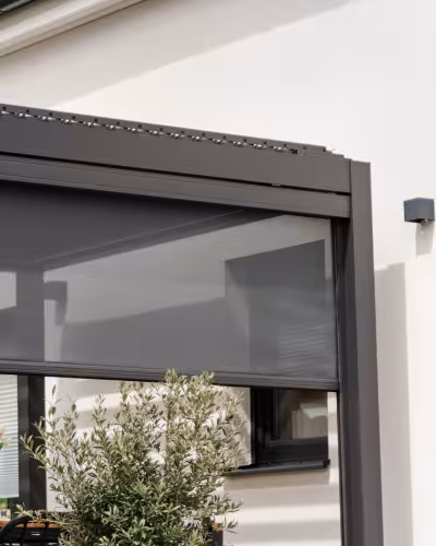 Outdoor zip screen blinds on a villa balcony in Dubai — open to reveal view