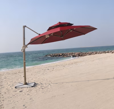 Model 7012 cantilever umbrella 360 rotation — wood-look arm with beige canopy Dubai villa