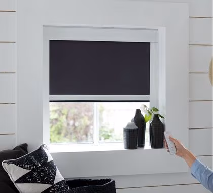 Completely dark bedroom thanks to blackout motorized roller blinds Dubai