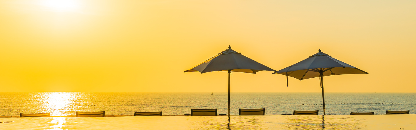 Large cantilever outdoor umbrella installed at a Dubai villa pool area — 360° rotation square canopy with marble stone base
