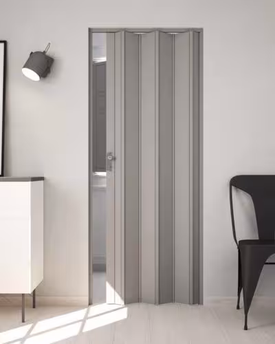 Gray pvc folding door installed for washroom door in a dubai home